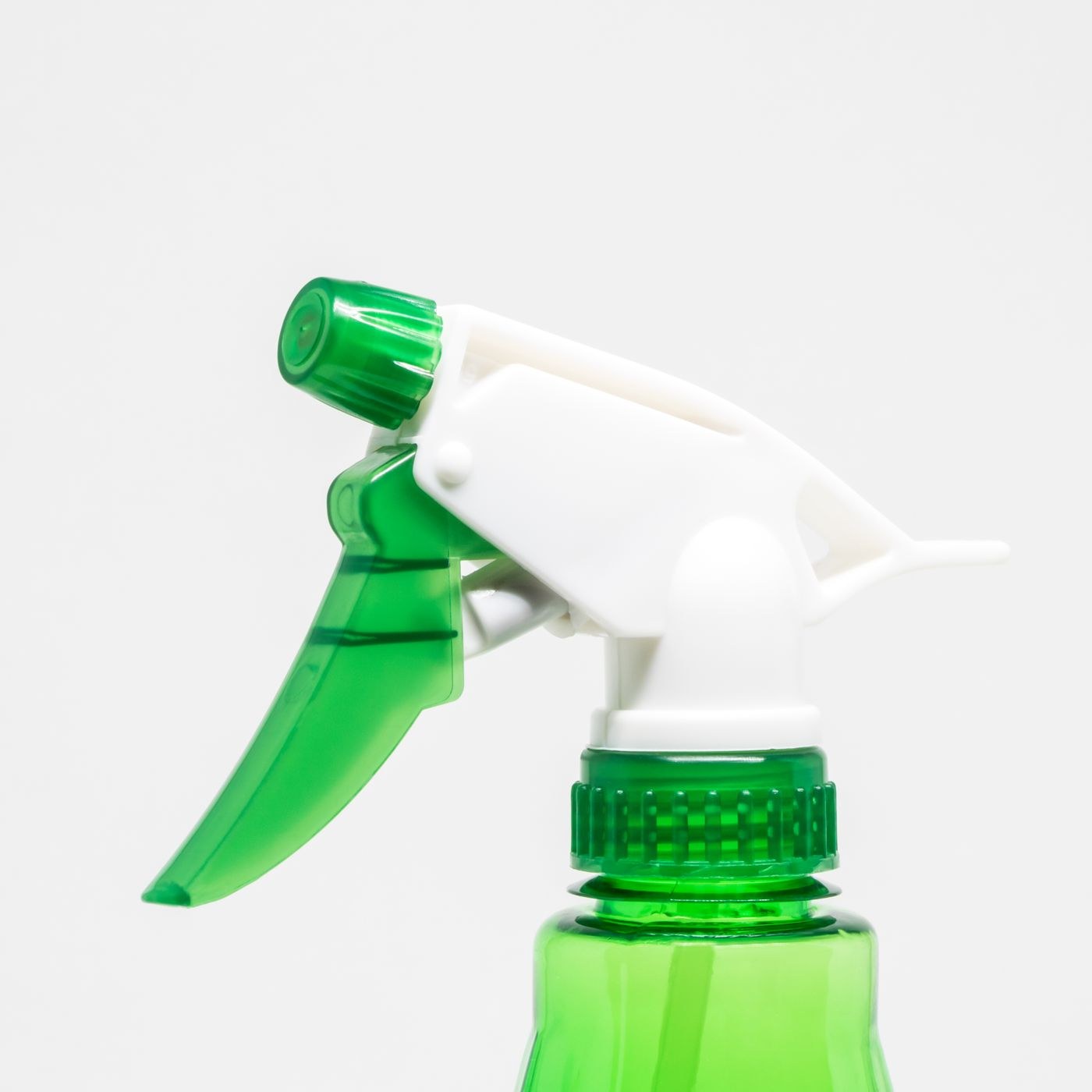 The nozzle and trigger of a spray bottle