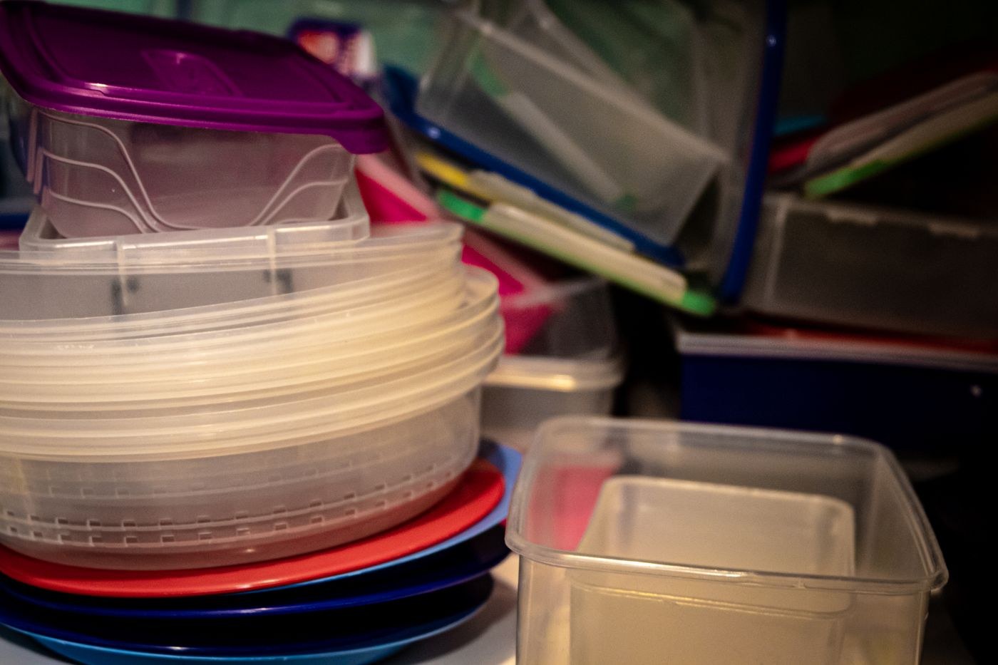 Stacked plastic food-storage containers and lids