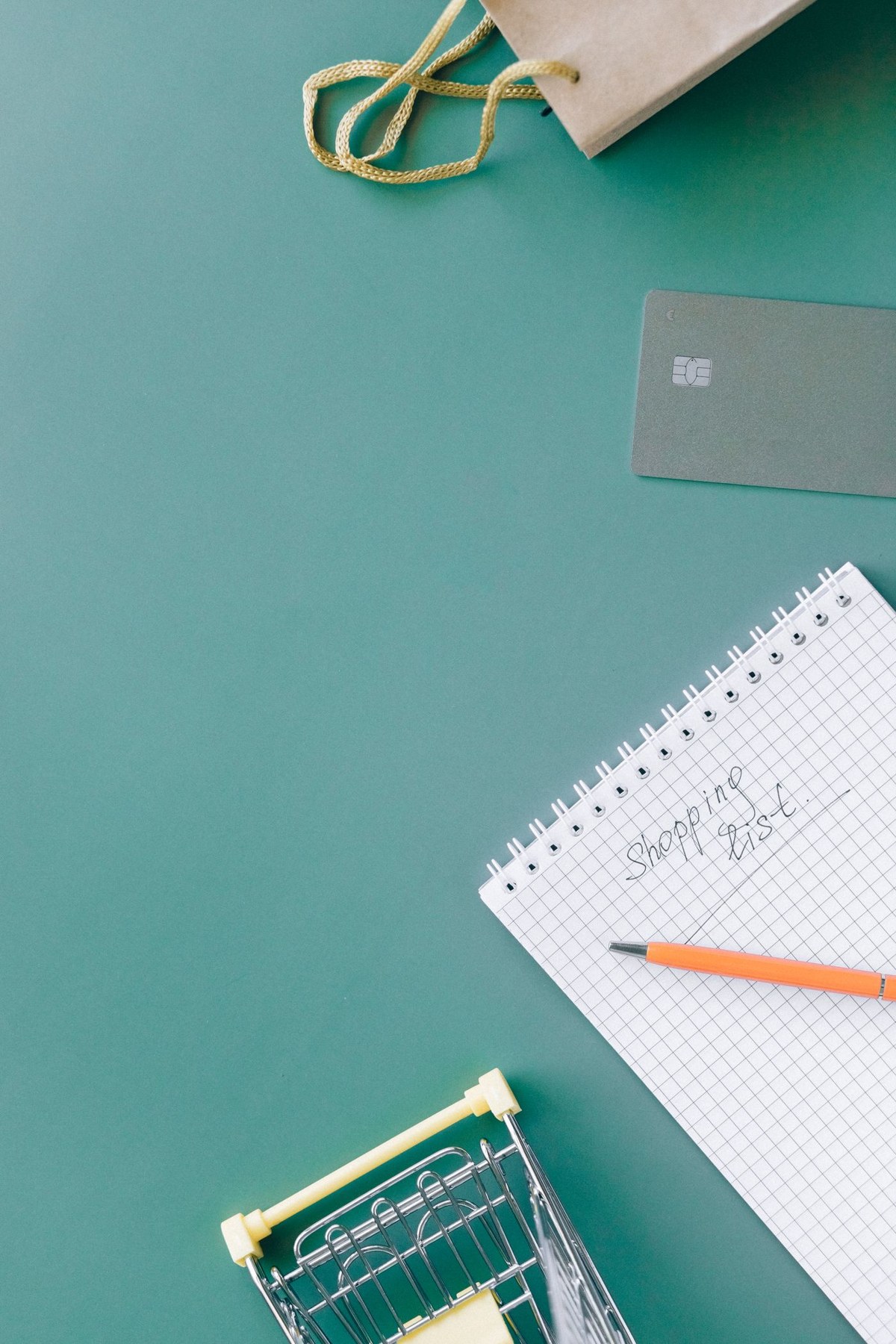 A shopping list in a spiral notebook